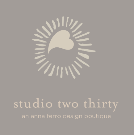 First-round concept: a sunburst around a heart above studio two thirty, on warm gray