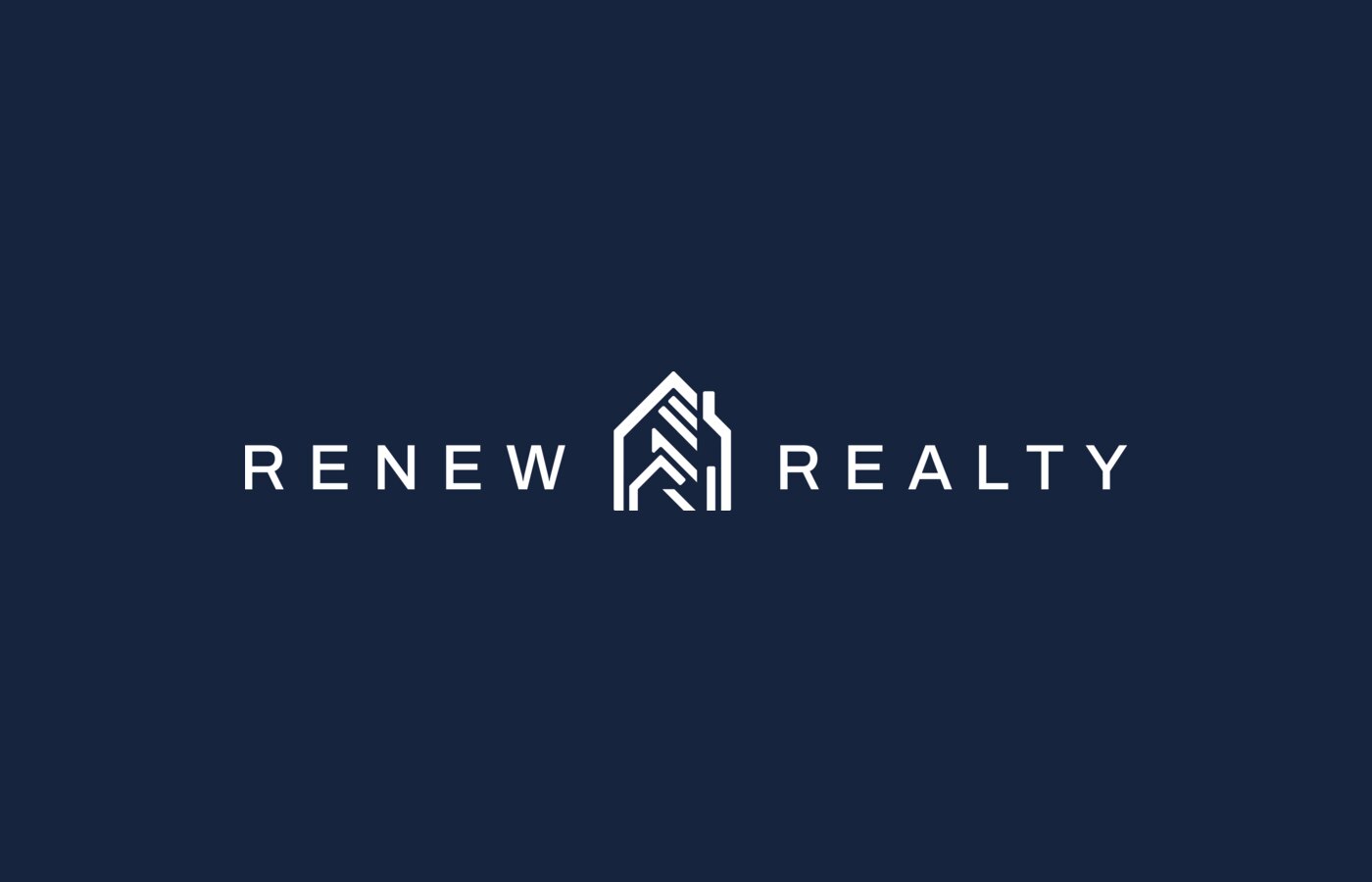Renew Realty logo reversed on navy