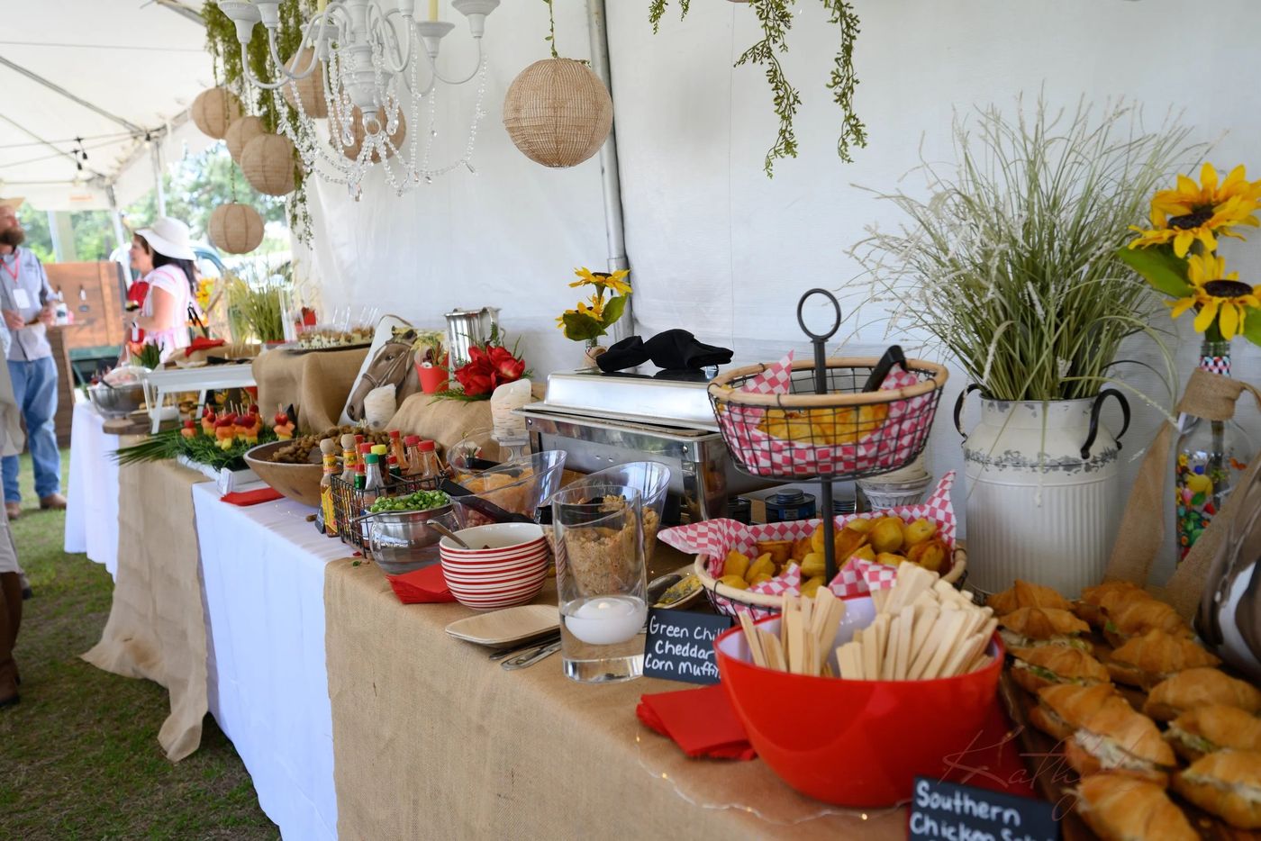 The food tent, set with flowers and a spread of dishes