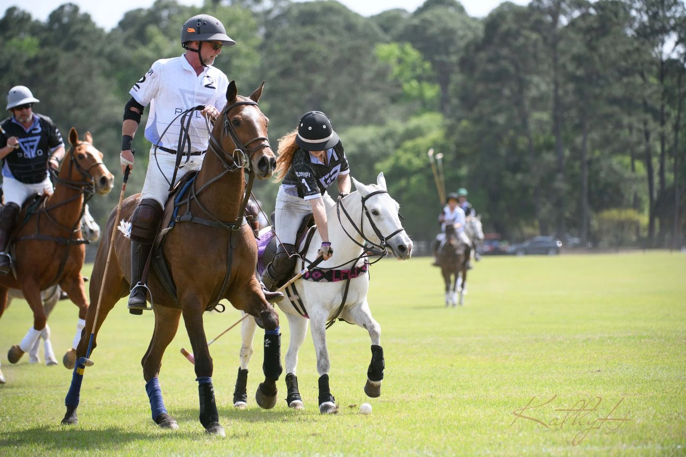 Riders racing for the ball during the 2023 match